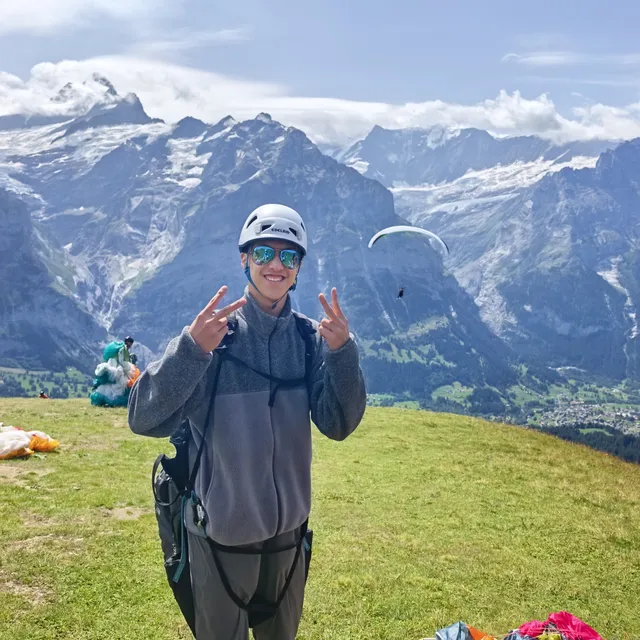 Noah paragliding in the Swiss Alps